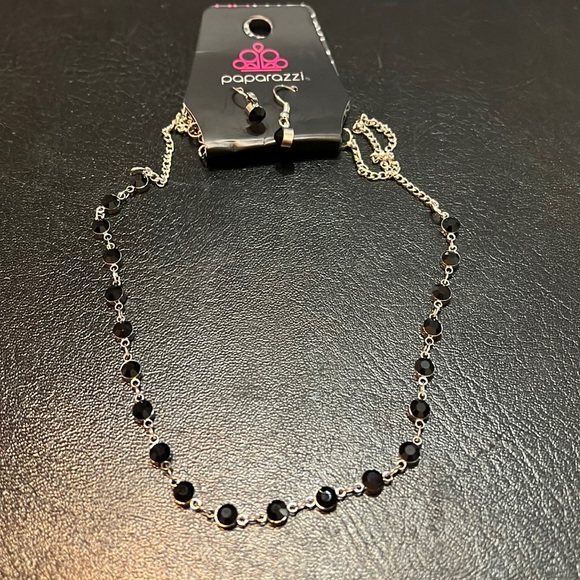 Short silver necklace with black gem stones